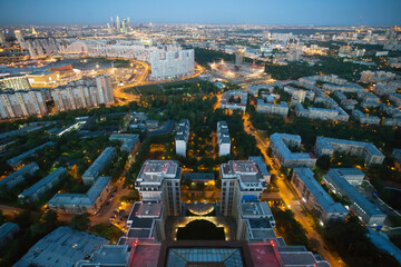 Obraz premium Residential area with buidlings, view from Triumph Palace building in Moscow, Russia at summer night
