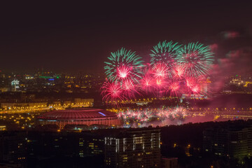 Fototapeta premium Bright firework above Luzhniki stadium at night in Moscow, Russia