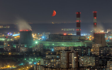 Territory of power plant and residential aera at summer moon night in Moscow, Russia