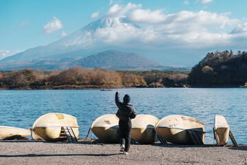 Woman tourist enjoy with Fuji Mountain at Lake Shoji, happy Traveler sightseeing Mount Fuji and...