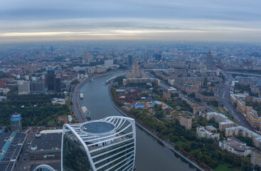 Fototapeta premium Evolution tower, Moscow river, Ukraine hotel in Moscow, Russia at evening