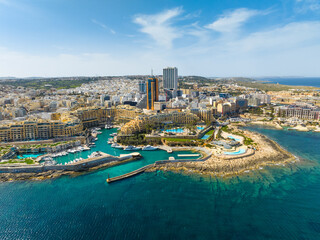 Landscape panorama of f St. Julian's city, modern high buildings. Malta island, Mediterranean sea