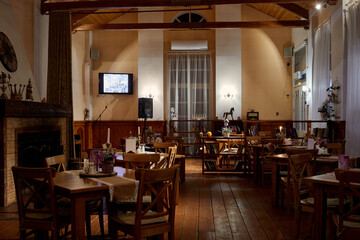 Fototapeta na wymiar Interior of restaurant Miraval in evening. The restaurant has 60 seats.