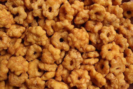 Background texture of Sakura Ribut, fried dough with flower shape, coated with seasoning powder. Snack from Indonesia