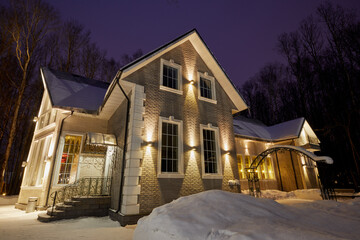  Illuminated guest house on winter evening 