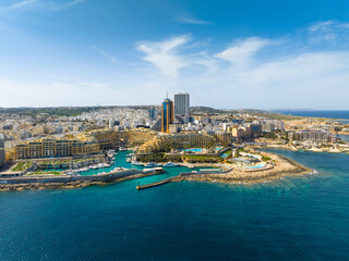 Landscape panorama of f St. Julian's city, modern high buildings. Day. Malta island, Mediterranean sea