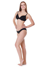 Obraz premium Beautiful smiling girl in underwear poses isolated on white background