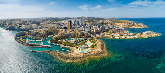 Landscape panorama of f St. Julian's city, modern high buildings. Day. Maltese island,...