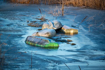 Boats frozen solid in ice on Lake Tysslingen Sweden