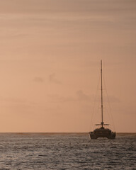 A Boat Silhouetted against the Stunning Sunset at SXM