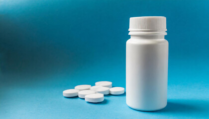 White plastic jar and heap of pills. Pharmaceutical vitamin or drug. Medical care and treatment.