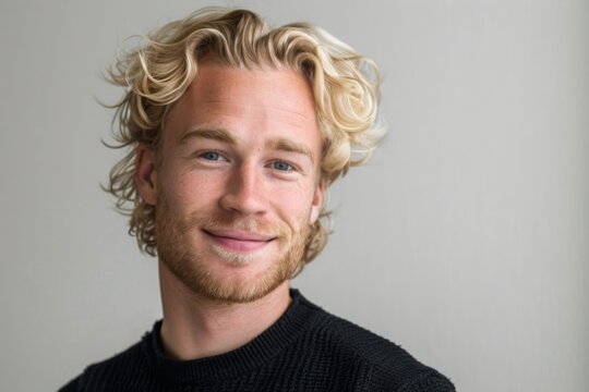 a closeup photo portrait of a handsome blonde scandinavian man smiling with clean teeth. for a dental ad. guy with fresh stylish hair with strong jawline. isolated on white background. 