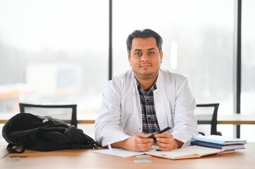 Fototapeta premium Portrait of a young doctor student studying