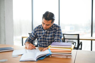 Portrait of cheerful male international Indian student with backpack. Education concept