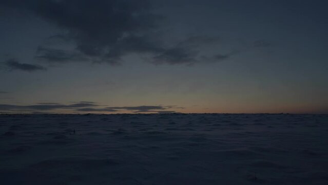 sunrise in winter over a snowy field, morning in winter, the landscape of the Antarctic, the field is covered with snow, Timelapse Video