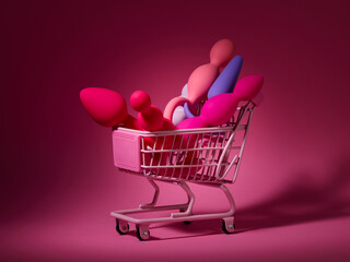 anal plugs and dildo sex toys in shopping basket over pink backdrop - 755706778
