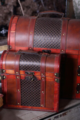 Stylish brown leather suitcases with metal clasps - big and small - in studio