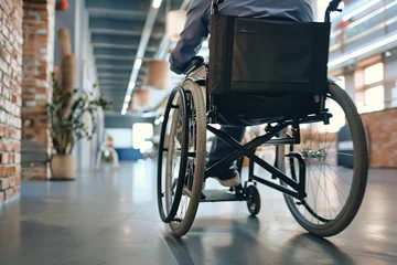 Fototapeten speaker in a wheelchair holding a meeting in the office © GEMES