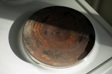 Electric stove in the kitchen. Old Electric Stove. Rust on steel.
