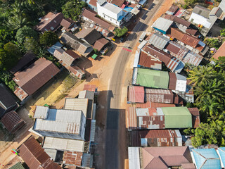 The center of a settlement in a small town, on the edge of a cross-regional road, in East Kotawaringin Regency, Central Kalimantan, Indonesia, seen from an aerial view.