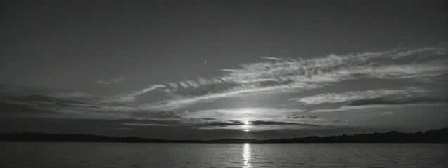Serene Black And White Sunset Over Calm Lake