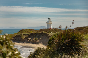 The Waipapa Point lighthouse overlooks the Pacific Ocean at the southern end of New Zealand. The...