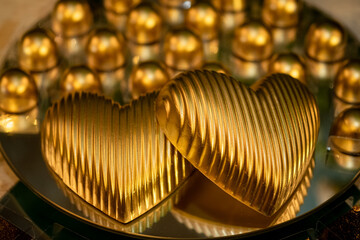 golden background, golden sweet balls, golden chocolate, party sweet, close up of sweet, glitter sweetie, heart shaped chocolate, Valentine's Day



