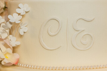 close up of cake, wedding cake, fondant cake, white cake, letter c, letter e
