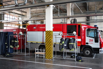  Garage with fire truck, uniform and fire-fighting equipment