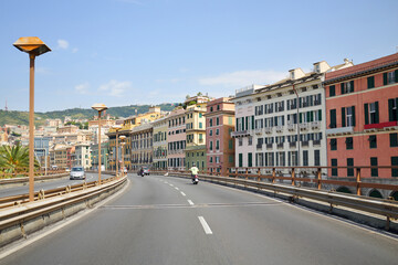 Overpass on waterfront in residential area in Genoa, Italy at sunny summer day