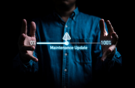 Businessman showing update progress status with exclamation caution warning sign for software development and program update after virus computer attack concept.