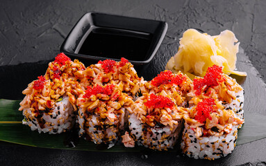 sushi rolls with salmon pieces and red caviar