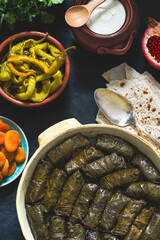 National Caucasian Armenian food. Seth from different dishes:delicious dolma - stuffed grape leaves with rice and meat,beans,jogurt,pomegranate,pita bread,pickled peppers,quince,cheese,apricots. 