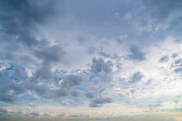 Background with a summer sky almost completely covered with white clouds. Bright sky in white tones.