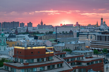 View of Moscow with churches, skyscrapers and beautiful sunset at evening