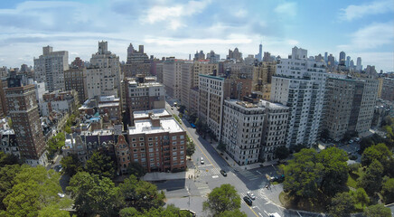 Cars ride by crossroad of Riverside Drive and West 79th street at summer day. Aerial view - Powered by Adobe