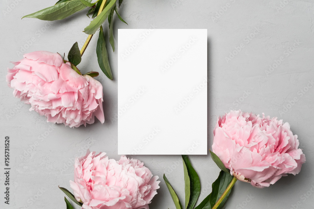 Wall mural Invitation or greeting card mockup with peony flowers, flat lay with copy space