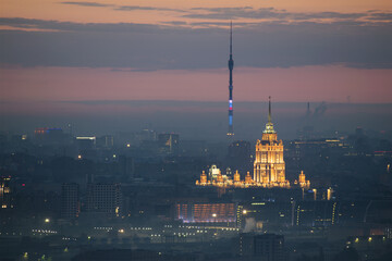 Moscow State University with illumination and Ostankino TV Tower at morning in Moscow