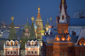 Close up view of part of St. Basil cathedral and historical museum on Red Square at night in Moscow