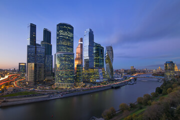 Fototapeta premium Cityscape of skyscrapers of Moscow City business complex and river. Moscow International Business Center Moscow City includes 20 futuristic buildings