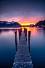 Foto op Aluminium purple Lake landscape with mountains and a jetty © Talha