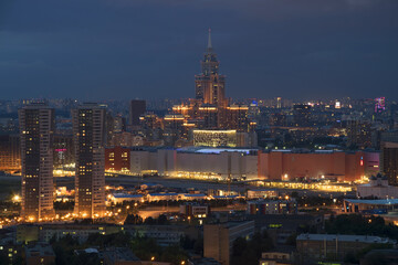 Naklejka premium Residential buildings, skyscrapers and roofs at summer night in Moscow, Russia