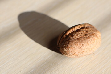 Walnut, a staple food ingredient, sits on a wooden table