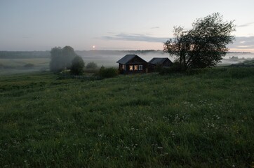Summer lonely house windows grass tree fog moon evening village