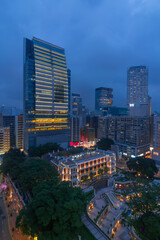 Skyscrapers and tall buildings in business area at evening in Hong Kong, China, view from Starhouse