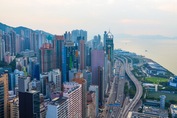 Fototapeta na wymiar Skyscrapers, highway on coast in business area at morning in Hong Kong, China, view from China Merchants Tower