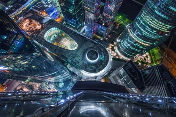 Foto op Plexiglas  Top view of shopping and entertainment complex Central Core of business complex Moscow City at night. Investments in project Central Core - 300 million dollars © Pavel Losevsky
