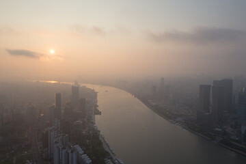 Shanghai in fog and sunrise at early morning, view from White Magnolia Plaza