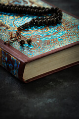 Close up image of Quran with prayer bead, Islamic prayer concept background