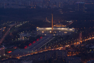 Victory park is architectural ensemble with monuments, obelisks at night in Moscow, Russia, top view